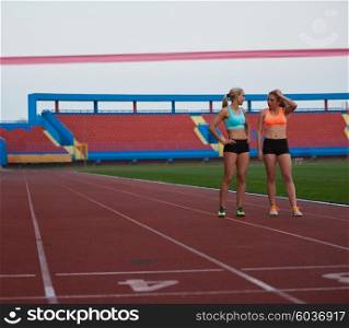Female Runners Finishing athletic Race Together