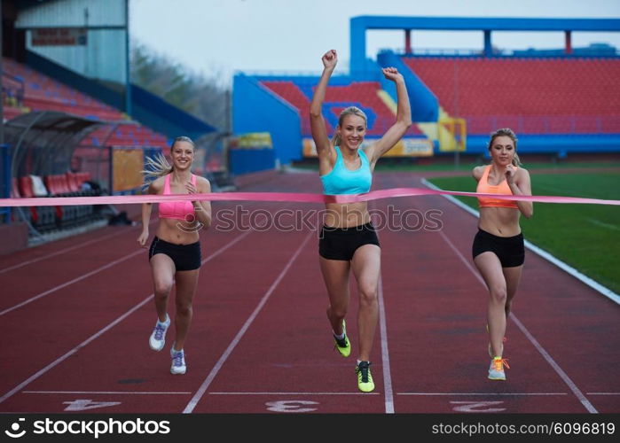 Female Runners Finishing athletic Race Together