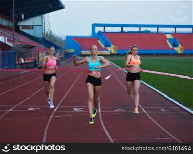Female Runners Finishing athletic Race Together
