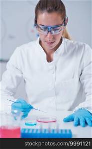 Female science researcher working in laboratory