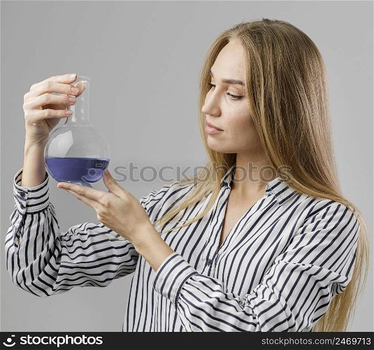 female scientist holding test tube