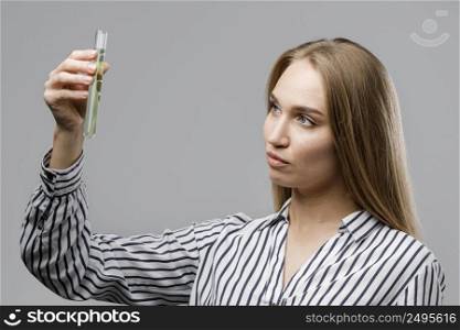 female scientist holding test tube