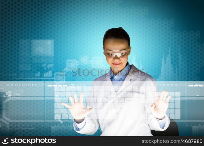 Female scientist. Image of young attractive woman scientist in protective eye wear