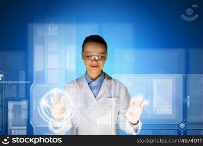 Female scientist. Image of young attractive woman scientist in protective eye wear