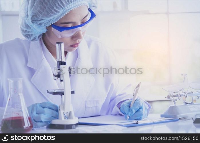 Female scientist look at microscope, science test tube analyse scientific sample in laboratory research experiment biotech make cultivate vaccine against virus. Chemistry science laboratory concept
