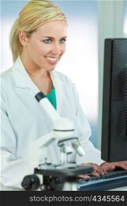 Female Scientist or Doctor Using Computer In Laboratory