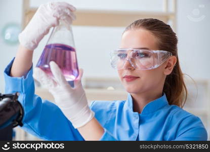 Female scientist researcher conducting an experiment in a labora. Female scientist researcher conducting an experiment in a laboratory