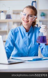 Female scientist researcher conducting an experiment in a labora. Female scientist researcher conducting an experiment in a laboratory