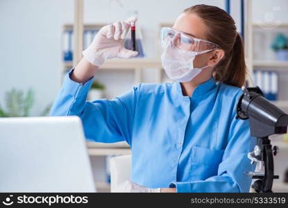 Female scientist researcher conducting an experiment in a labora. Female scientist researcher conducting an experiment in a laboratory