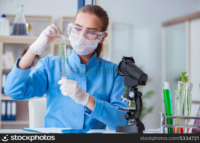 Female scientist researcher conducting an experiment in a labora. Female scientist researcher conducting an experiment in a laboratory