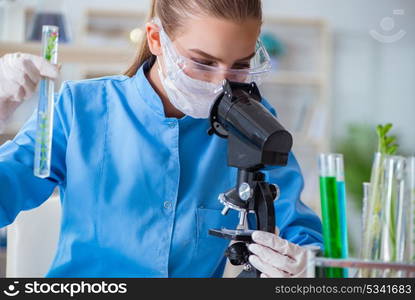 Female scientist researcher conducting an experiment in a labora. Female scientist researcher conducting an experiment in a laboratory