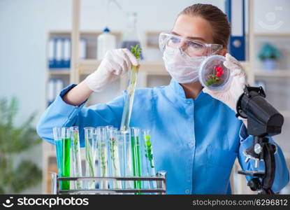 Female scientist researcher conducting an experiment in a labora. Female scientist researcher conducting an experiment in a laboratory