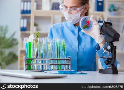 Female scientist researcher conducting an experiment in a labora. Female scientist researcher conducting an experiment in a laboratory