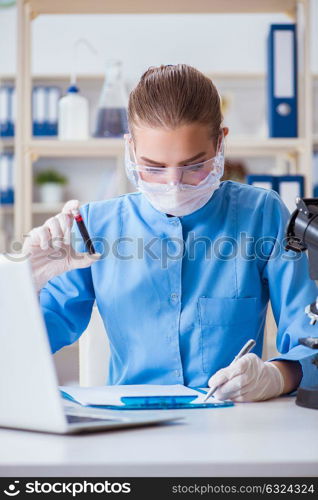 Female scientist researcher conducting an experiment in a labora. Female scientist researcher conducting an experiment in a laboratory