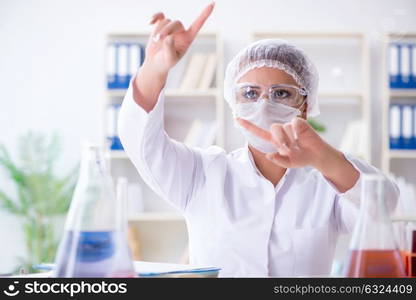 Female scientist researcher conducting an experiment in a labora. Female scientist researcher conducting an experiment in a laboratory