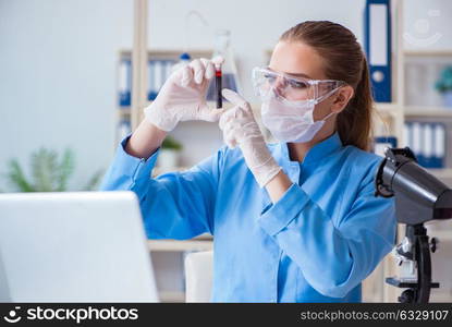 Female scientist researcher conducting an experiment in a labora. Female scientist researcher conducting an experiment in a laboratory