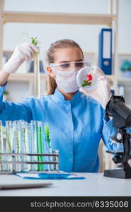 Female scientist researcher conducting an experiment in a labora. Female scientist researcher conducting an experiment in a laboratory