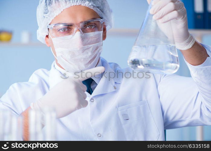 Female scientist researcher conducting an experiment in a labora. Female scientist researcher conducting an experiment in a laboratory