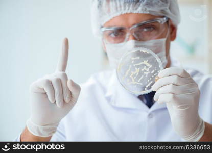 Female scientist researcher conducting an experiment in a labora. Female scientist researcher conducting an experiment in a laboratory