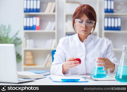 Female scientist researcher conducting an experiment in a labora. Female scientist researcher conducting an experiment in a laboratory