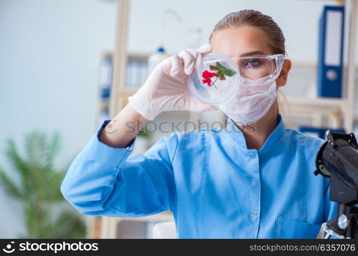 Female scientist researcher conducting an experiment in a labora. Female scientist researcher conducting an experiment in a laboratory