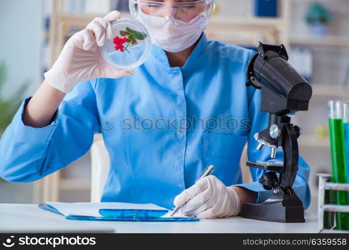 Female scientist researcher conducting an experiment in a labora. Female scientist researcher conducting an experiment in a laboratory