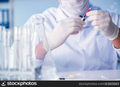 Female scientist researcher conducting an experiment in a labora. Female scientist researcher conducting an experiment in a laboratory