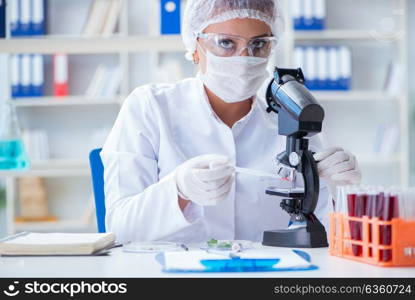 Female scientist researcher conducting an experiment in a labora. Female scientist researcher conducting an experiment in a laboratory