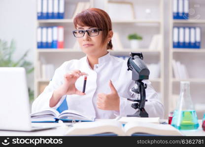 Female scientist researcher conducting an experiment in a labora. Female scientist researcher conducting an experiment in a laboratory