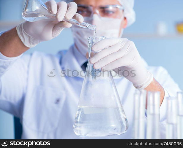 Female scientist researcher conducting an experiment in a laboratory. Female scientist researcher conducting an experiment in a labora