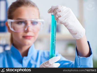 Female scientist researcher conducting an experiment in a laboratory. Female scientist researcher conducting an experiment in a labora