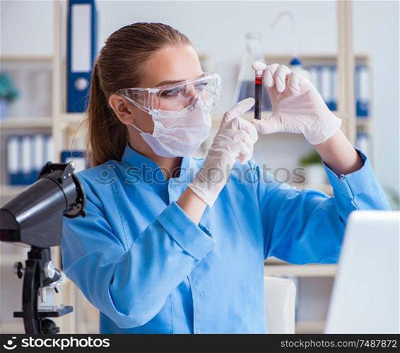 Female scientist researcher conducting an experiment in a laboratory. Female scientist researcher conducting an experiment in a labora