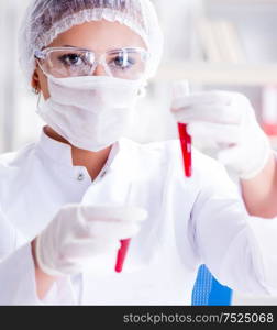 Female scientist researcher conducting an experiment in a laboratory. Female scientist researcher conducting an experiment in a labora