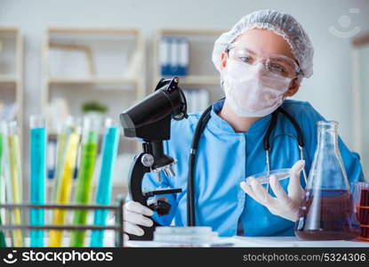 Female scientist researcher doing experiments in laboratory