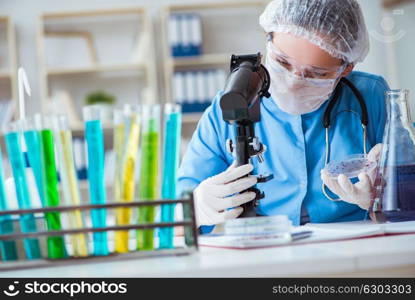 Female scientist researcher doing experiments in laboratory