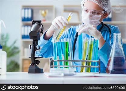 Female scientist researcher doing experiments in laboratory