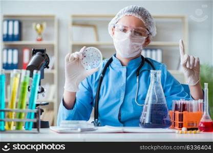 Female scientist researcher doing experiments in laboratory