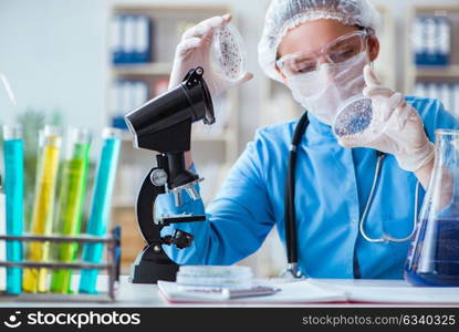 Female scientist researcher doing experiments in laboratory