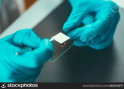 Female scientist researching s&les in laboratory