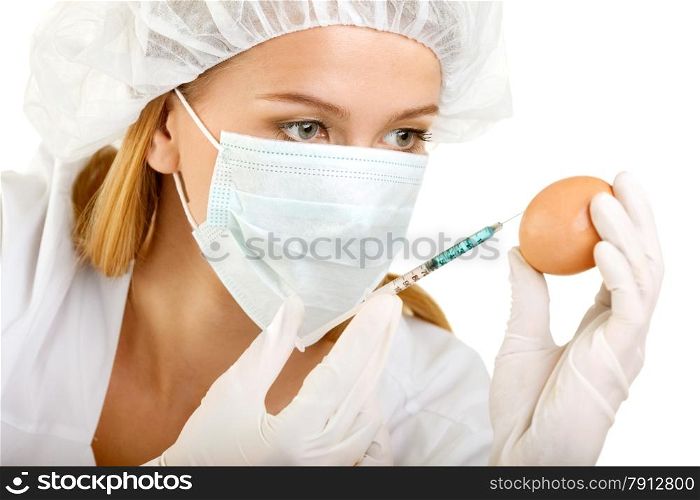 Female Scientist with a Syringe and an Egg