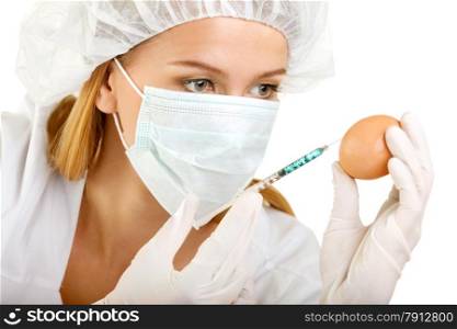 Female Scientist with a Syringe and an Egg
