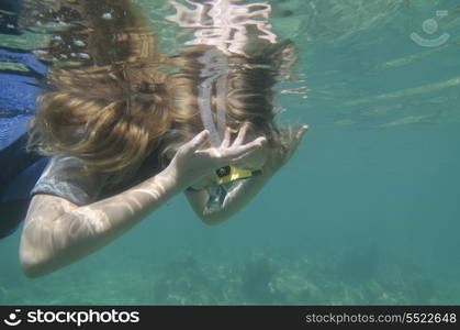 Female scuba diver in the sea, Utopia Village, Utila, Bay Islands, Honduras