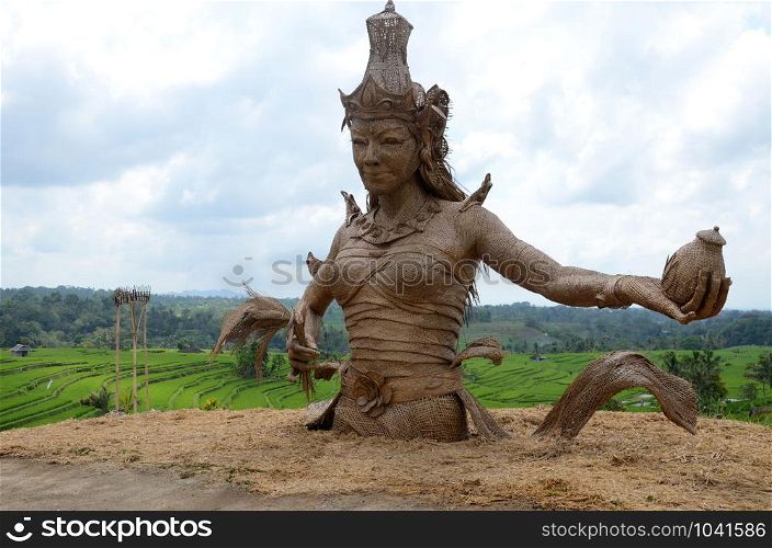 Female sculpture at rice fields of Jatiluwih in southeast Bali, Indonesia