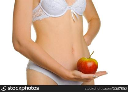Female shapely a body and a red apple. It is isolated on a white background
