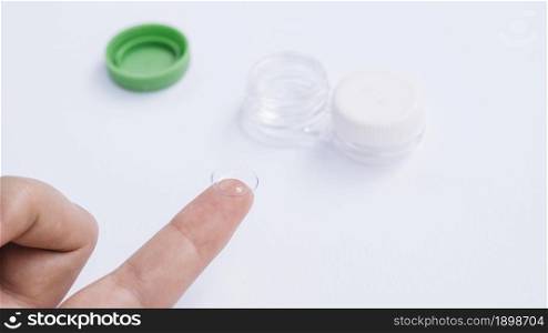 female showing contact lenses his finger. Resolution and high quality beautiful photo. female showing contact lenses his finger. High quality beautiful photo concept