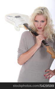 female singer posing with electric guitar