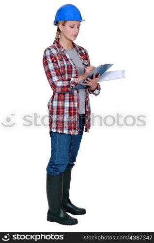 Female site surveyor with clipboard