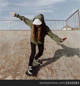 female skateboarder using ramps tricks 2