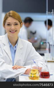 female smiling chemistry in laboratory