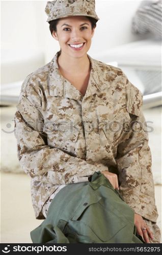 Female Soldier With Kit Bag Home For Leave